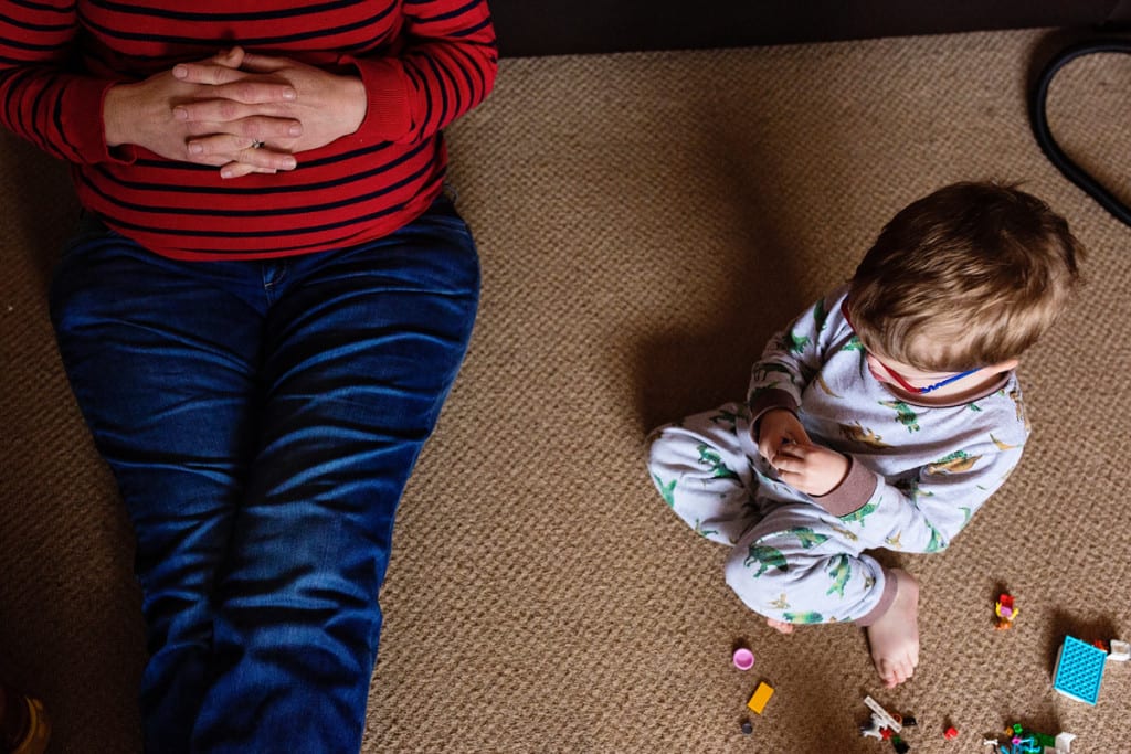 son and mom on floor during London family photography session