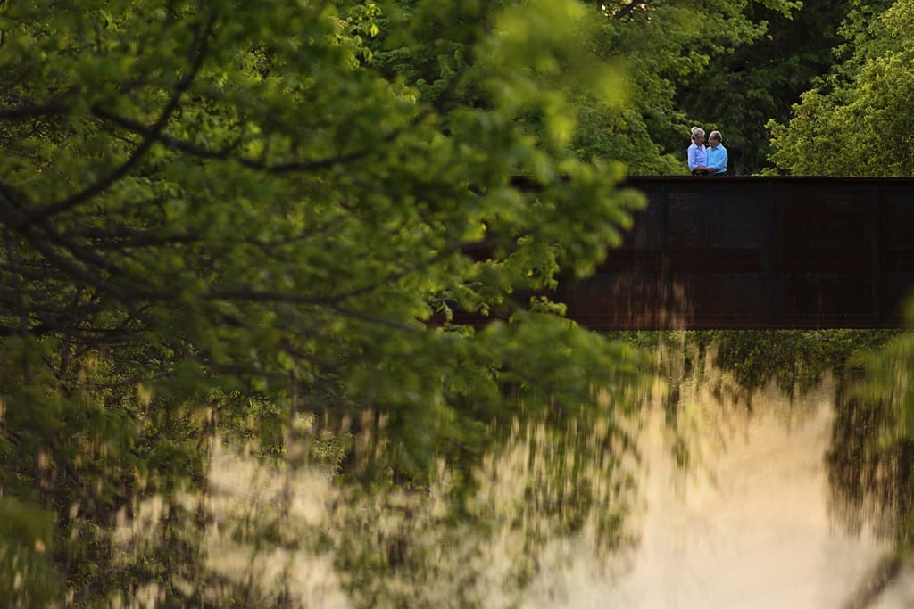 couple standing together on bridge for Williamstown engagement session