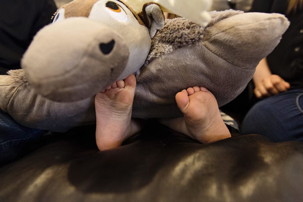 toes under pillow during family portrait session