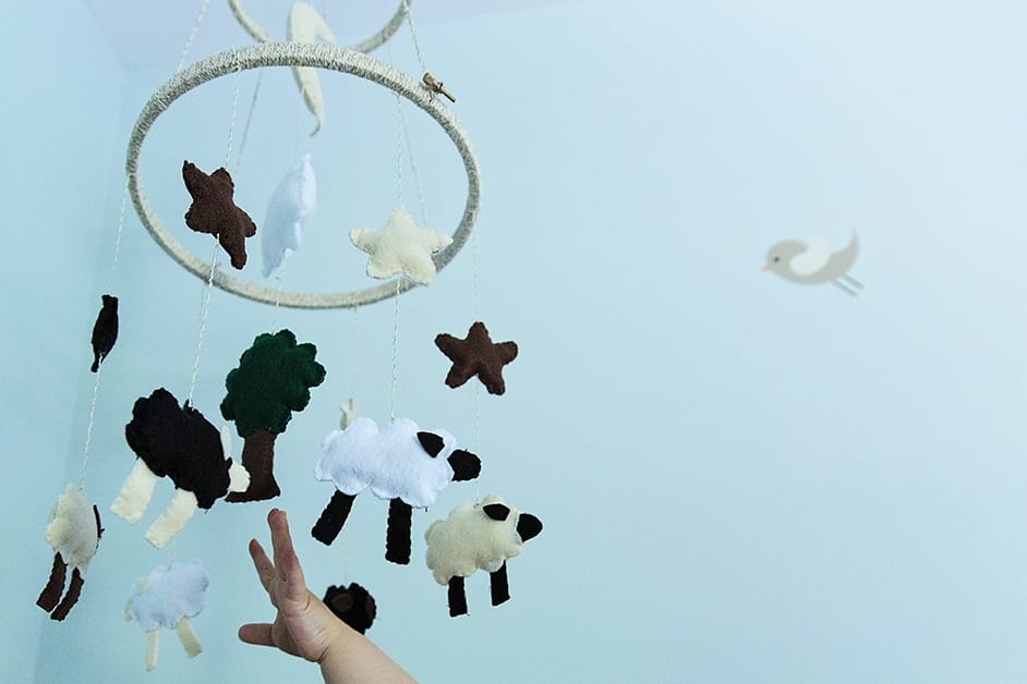 reaching for mobile during family portrait session