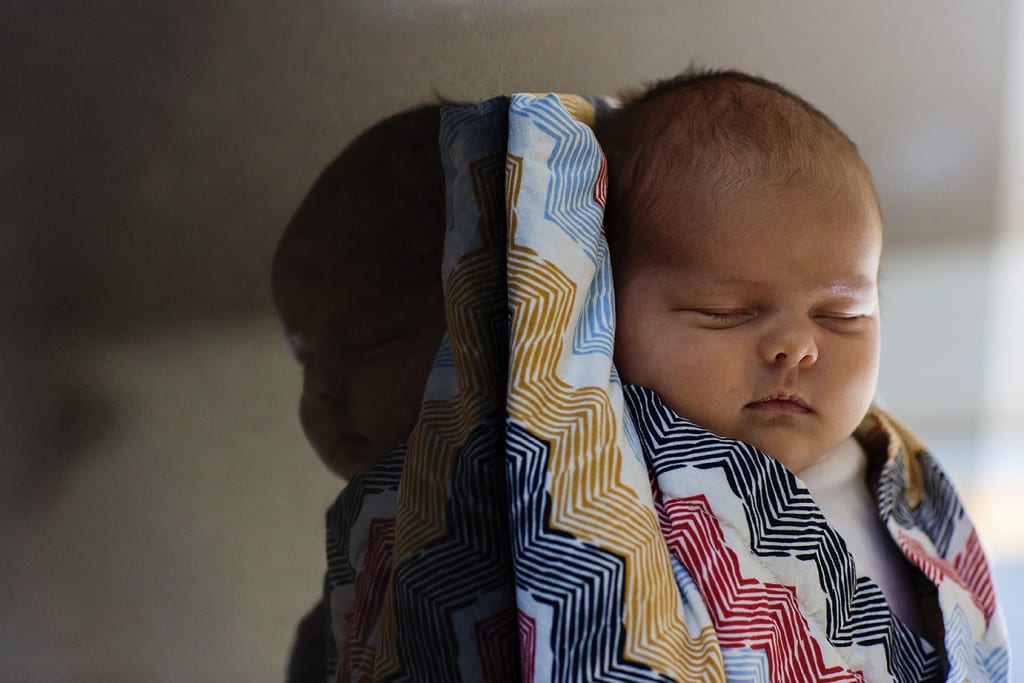 baby on counter during family portrait session