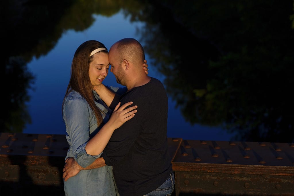 Couple outlined by reflection in river during St Raphael's engagement session