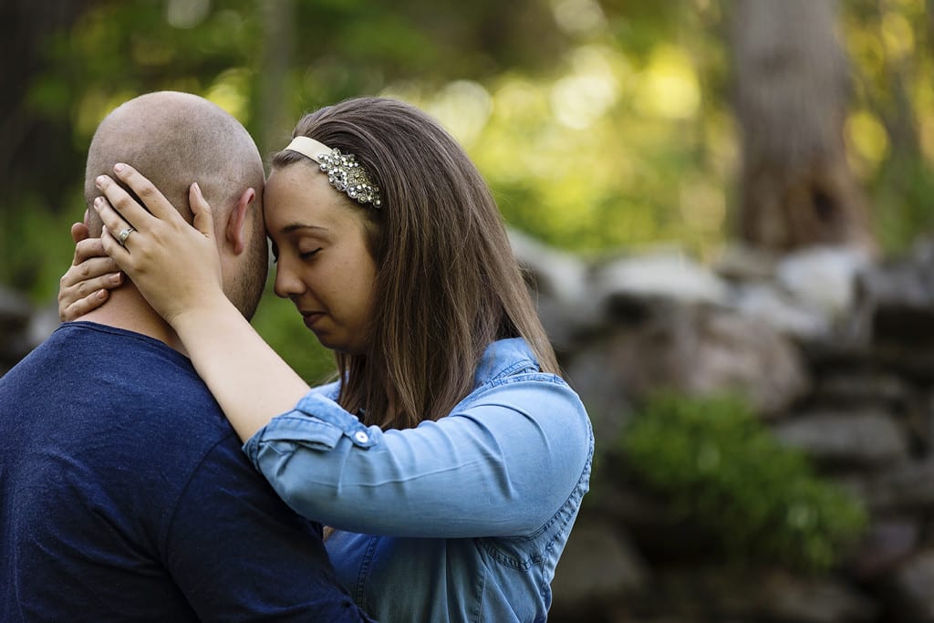Woman cuddles up to fiance during St Raphael's engagement session