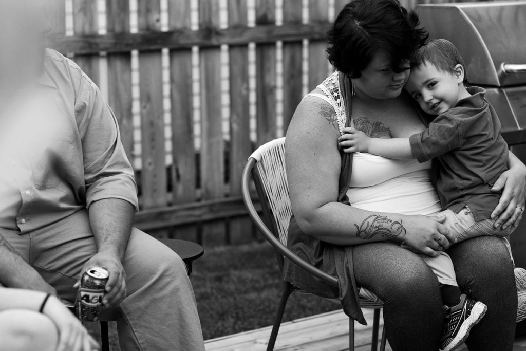 cheeky boy on mom's lap