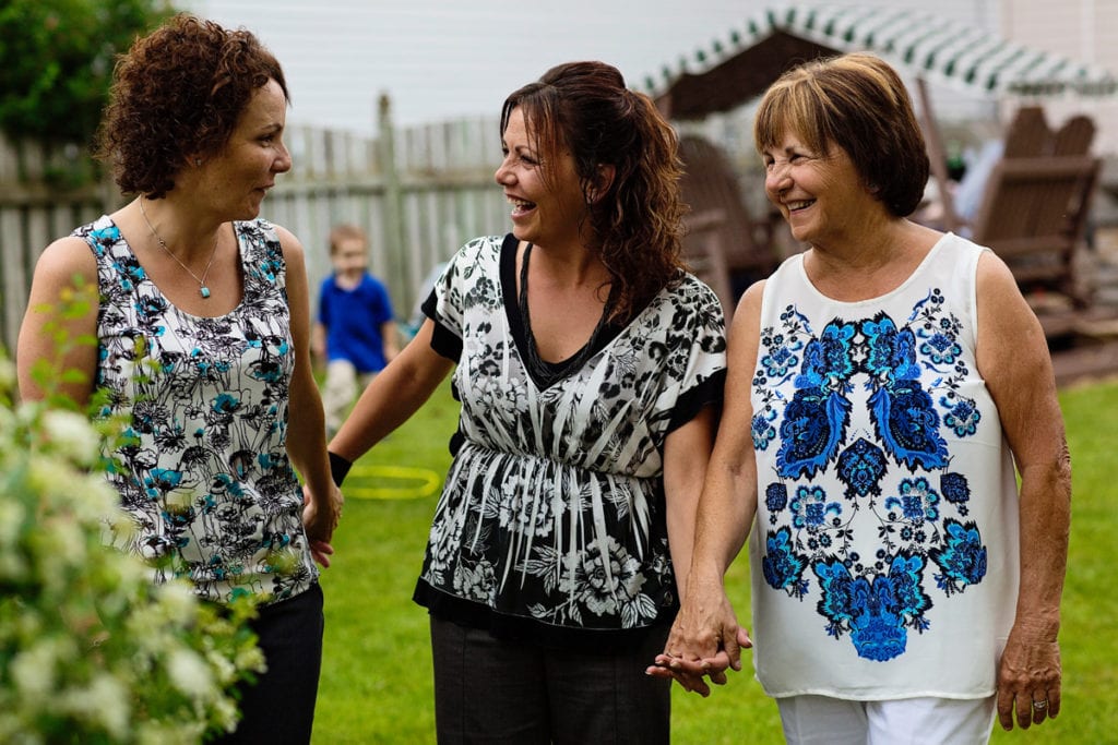 mother and daughters holding hands