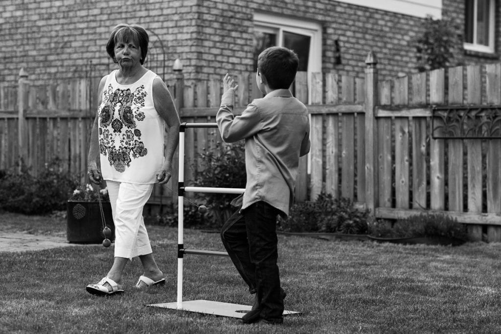 boy playing summer games with grandmother