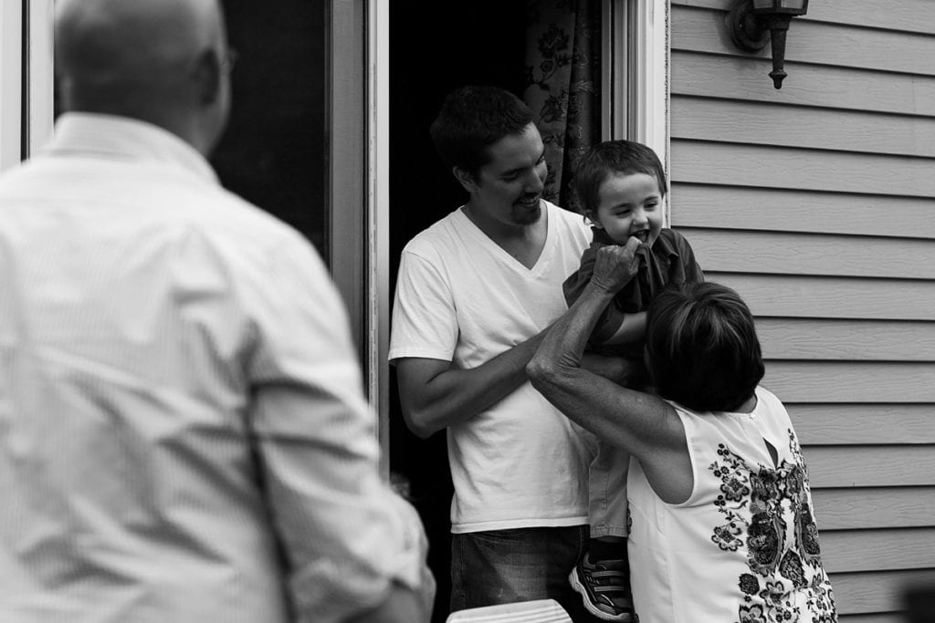 grandma and grandson laughing at summer party
