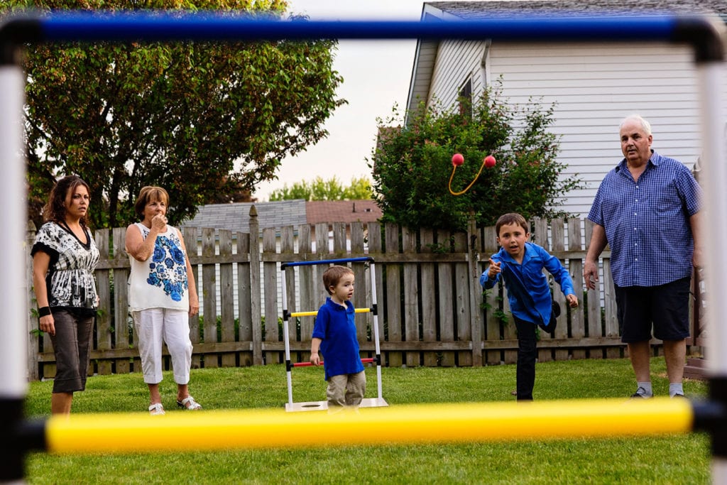 boys in backyard playing summer games