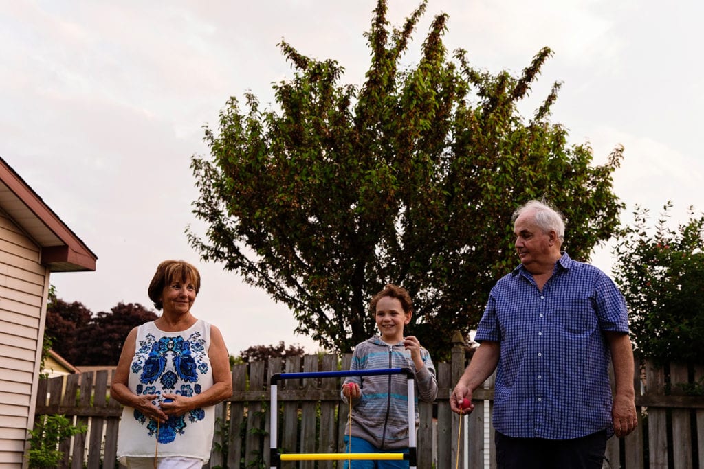 boy playing summer games with grandparents