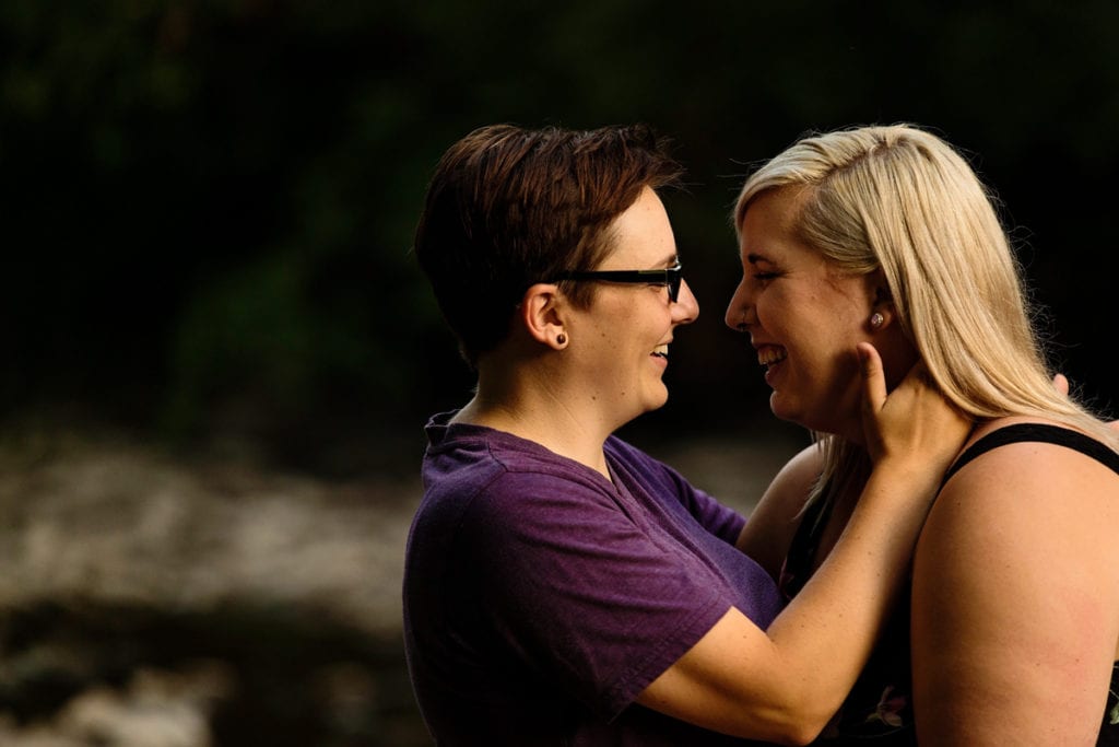 Women laughing in outdoor engagement shoot