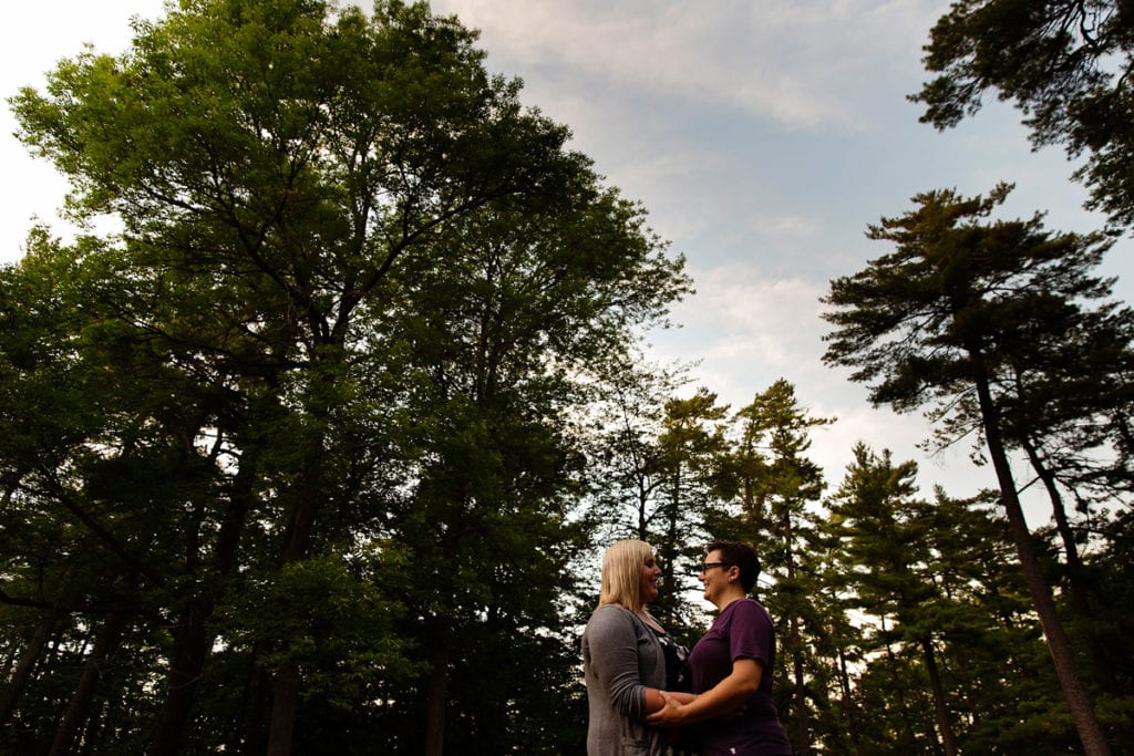 LGBT couple engagement in woods