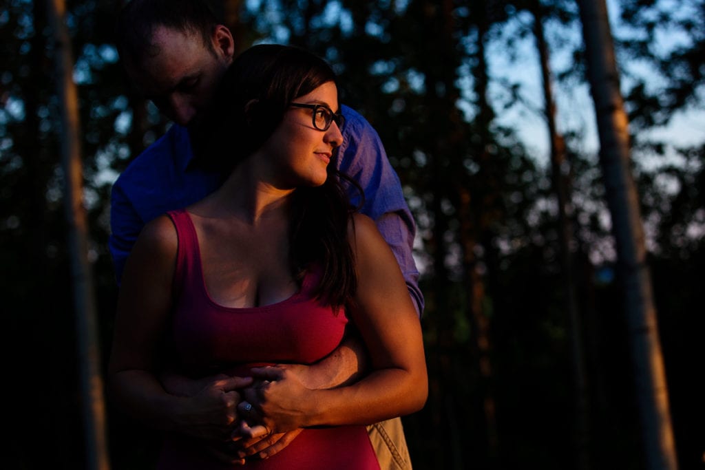 Couple hugging in Rural ontario sunset engagement