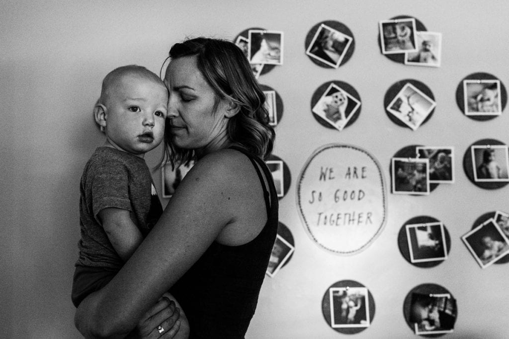 Mom with eyes closed holding baby