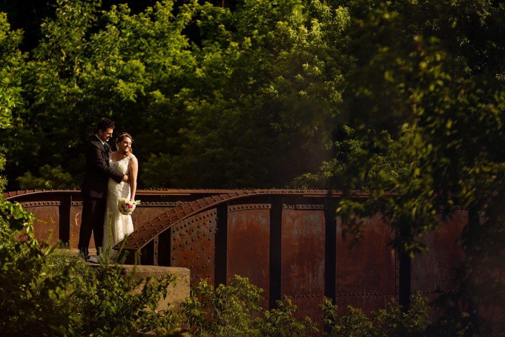 Bride and groom in sunset photo on Williamstown bridge