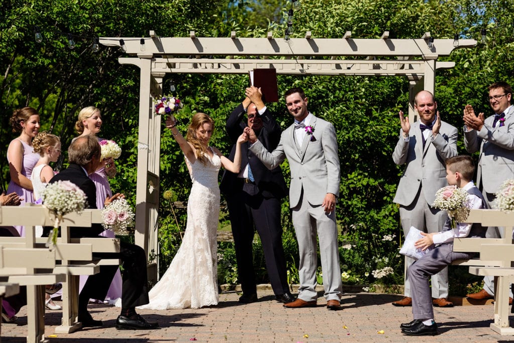 Bride and groom celebrating officially being married at intimate Strathmere wedding