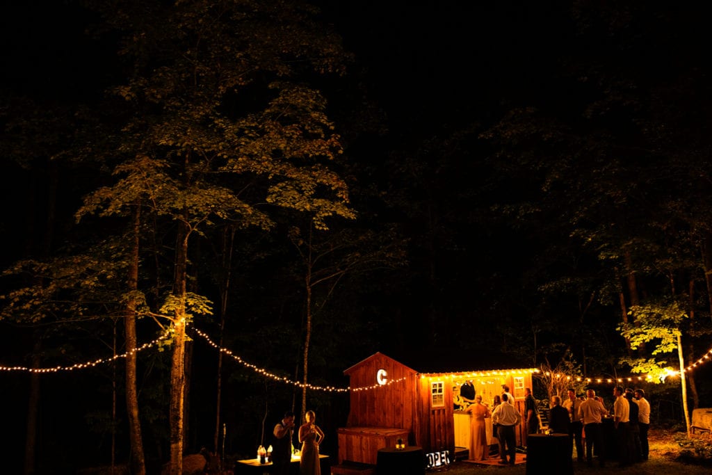 Rural Ontario backyard wedding reception with cabin bar