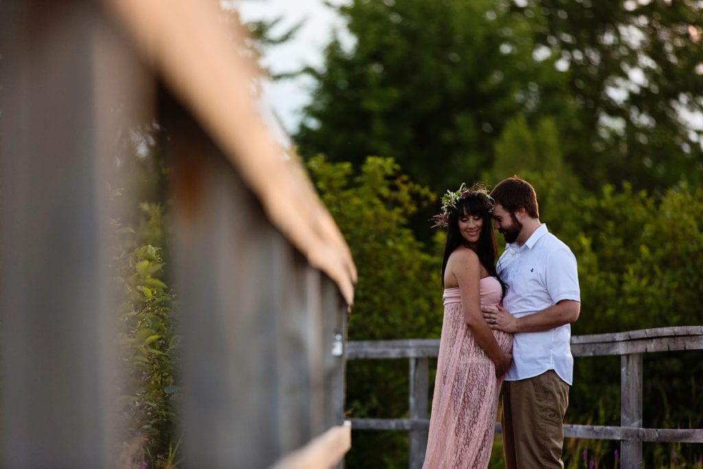 Bohemian woman and husband on boardwalk in nature park