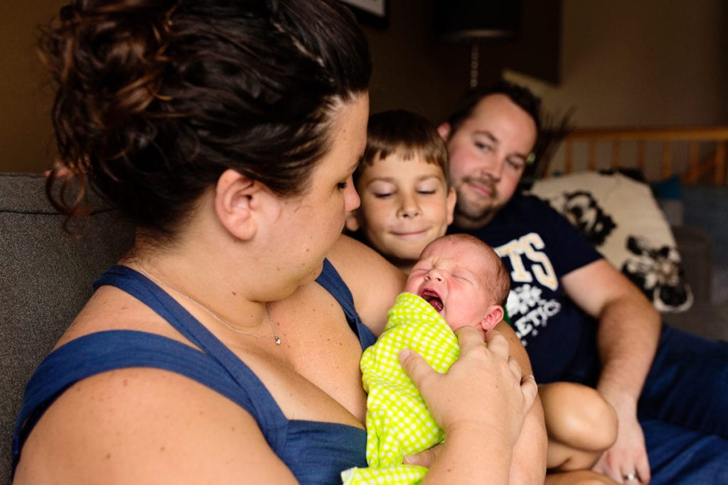 Young family with son and new baby boy