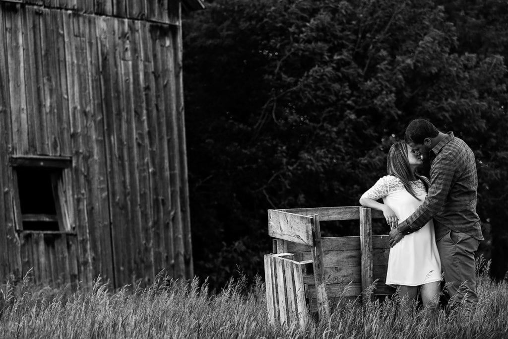 Beautiful couple kissing in Rural Cornwall engagement session