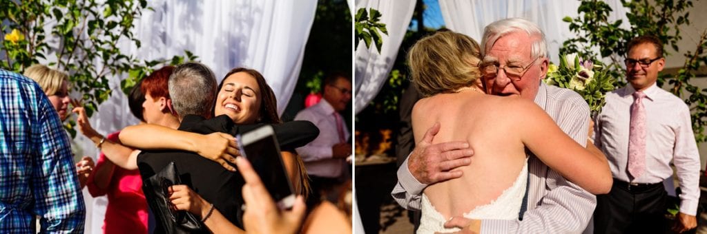 guests hugging and congratulating bride at chic cornwall summer wedding