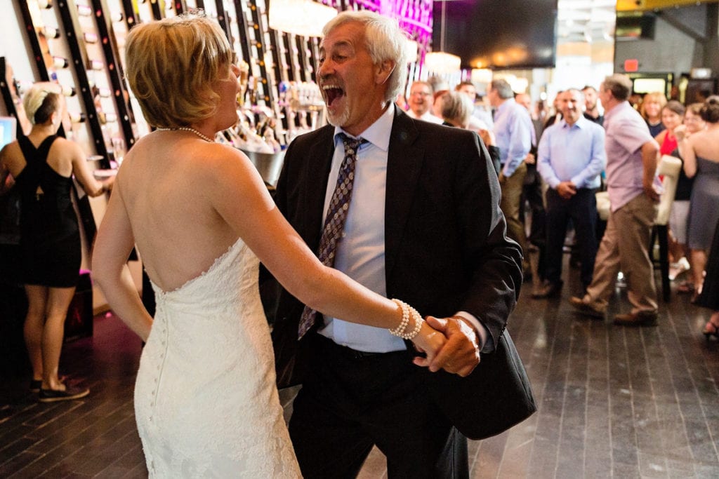 bride and father dancing and laughing at chic cornwall wedding
