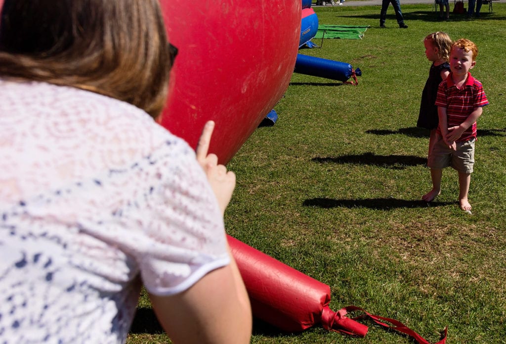mom warning little boy in outdoor park family session