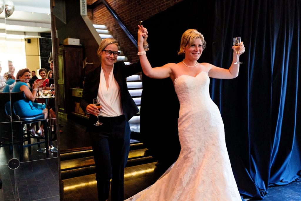 brides celebrate with champagne at edgy cornwall wedding