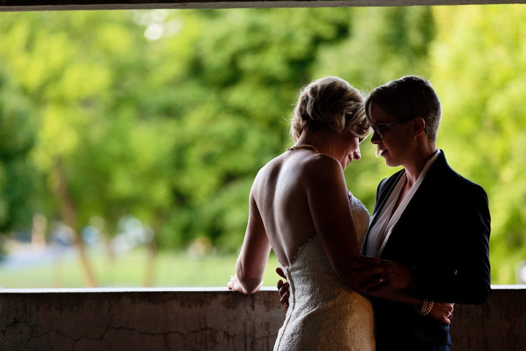 brides romantic embrace in same-sex Cornwall wedding