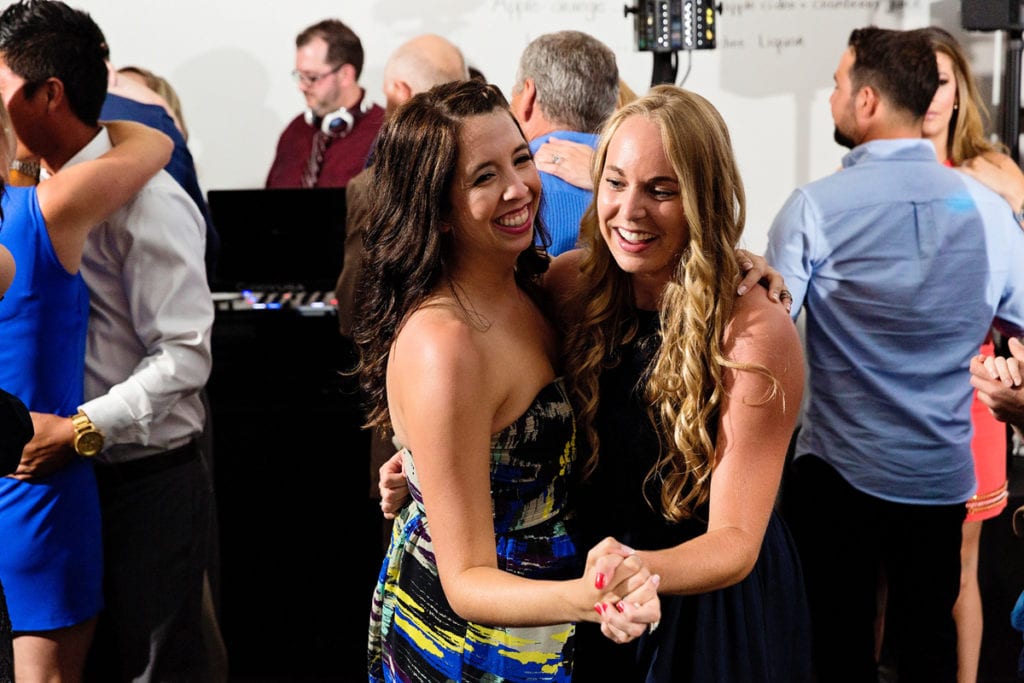 reception guests in cocktail dresses dancing at chic cornwall wedding
