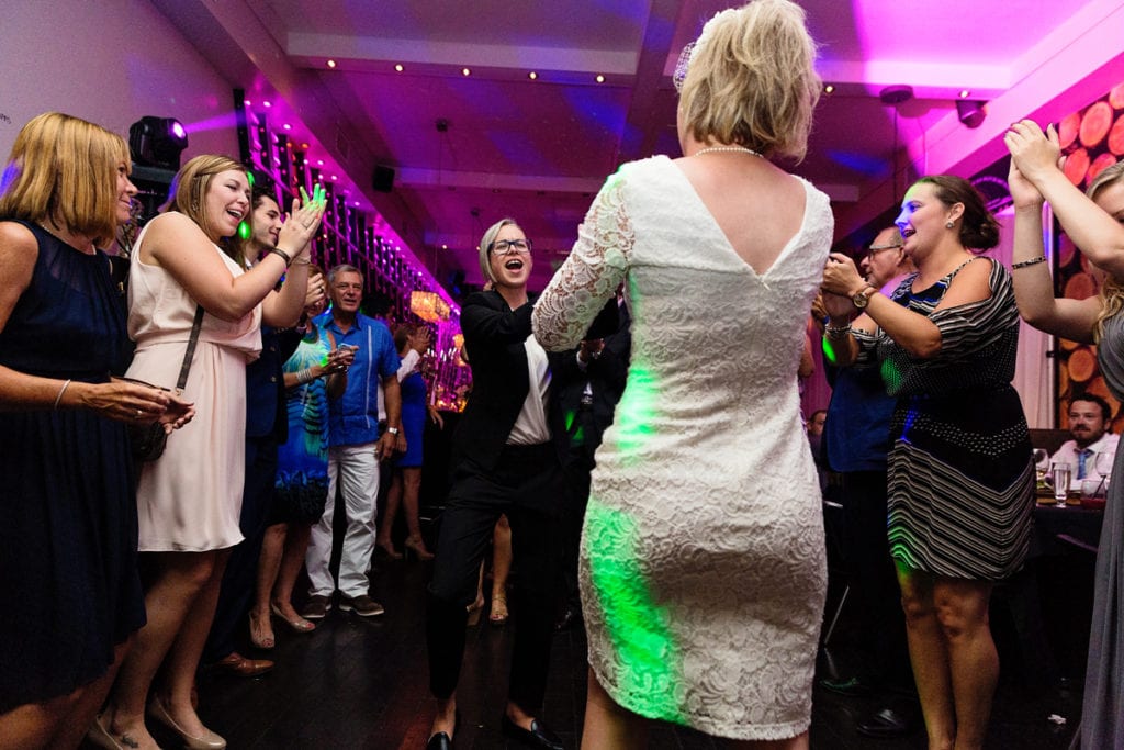 brides dancing at same-sex wedding chic reception