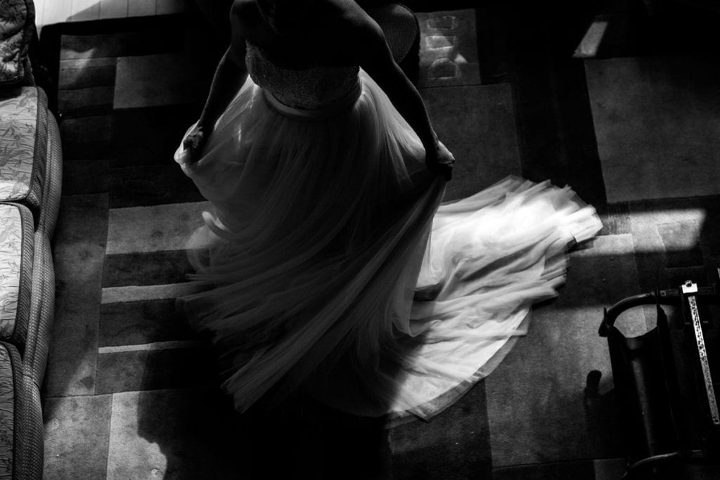 bride twirling in soft flowy wedding dress in cabin at Calabogie wedding