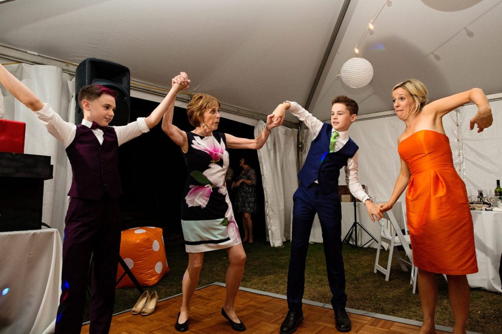 reception guests and teens dancing at intimate Calabogie wedding reception