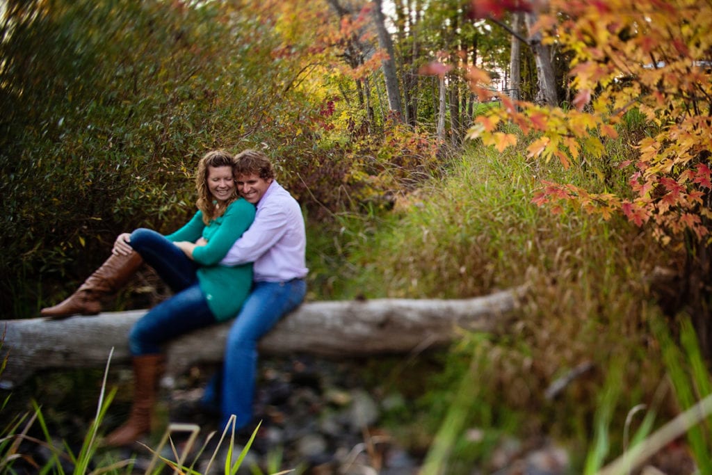 couple laughing during rural fall engagement session