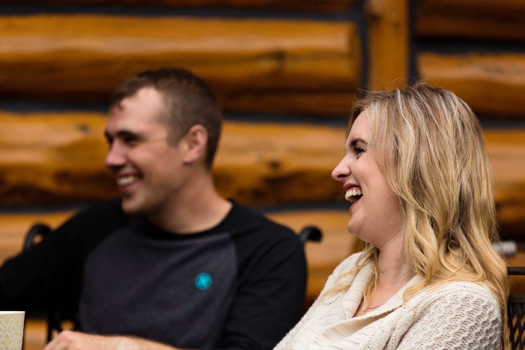 young smiling couple laughing with family during casual rural ontario shoot