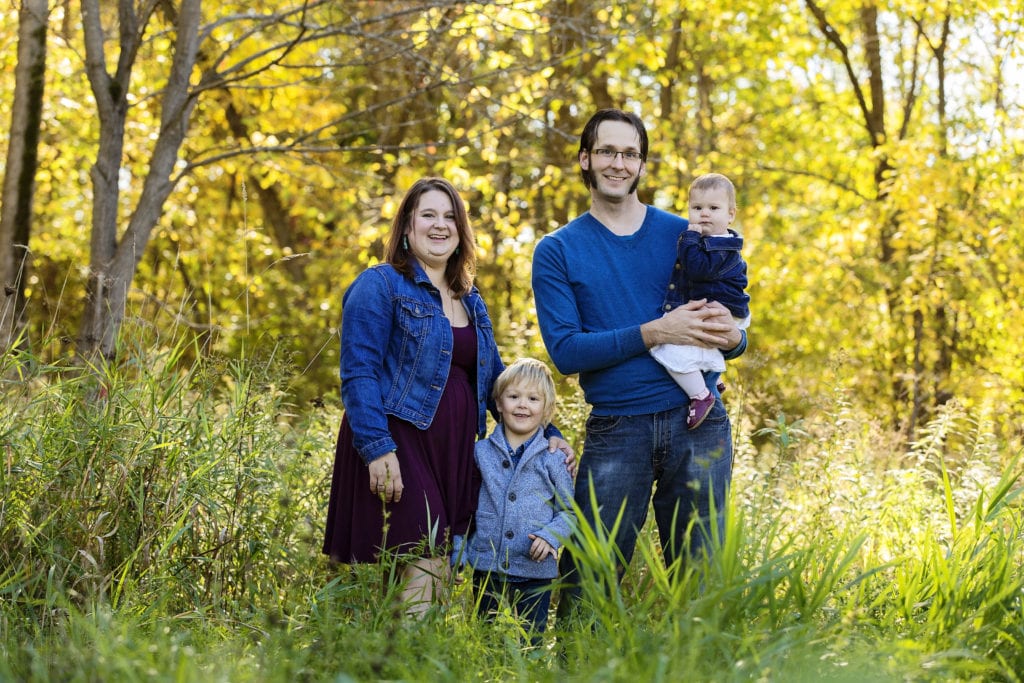young family in blue color scheme family portrait