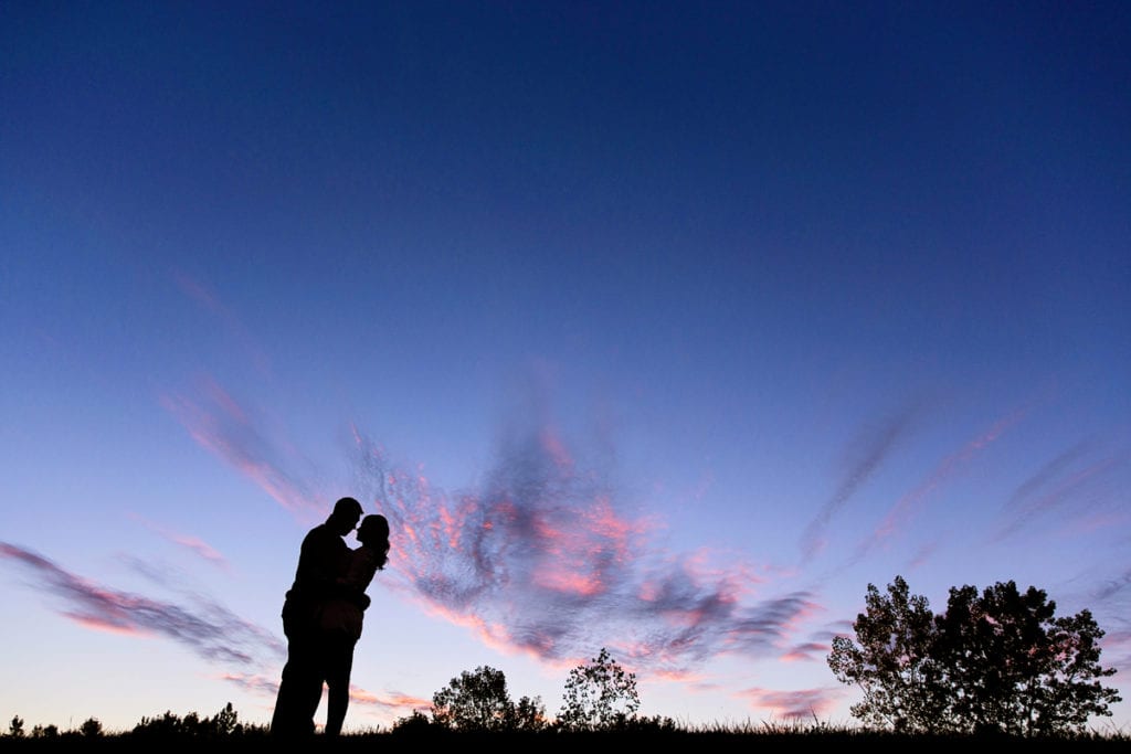 sunset fall engagement session with silhouetted couple
