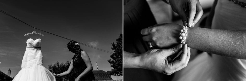 bride hangs dress and puts on bracelet