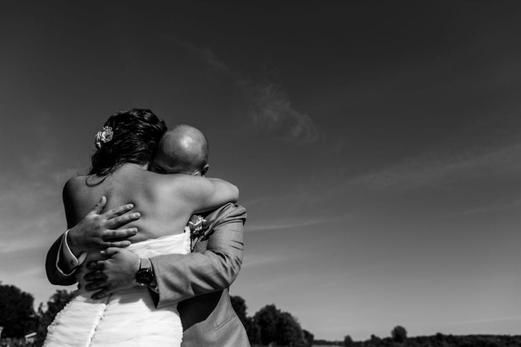 Bride and groom hug during first look