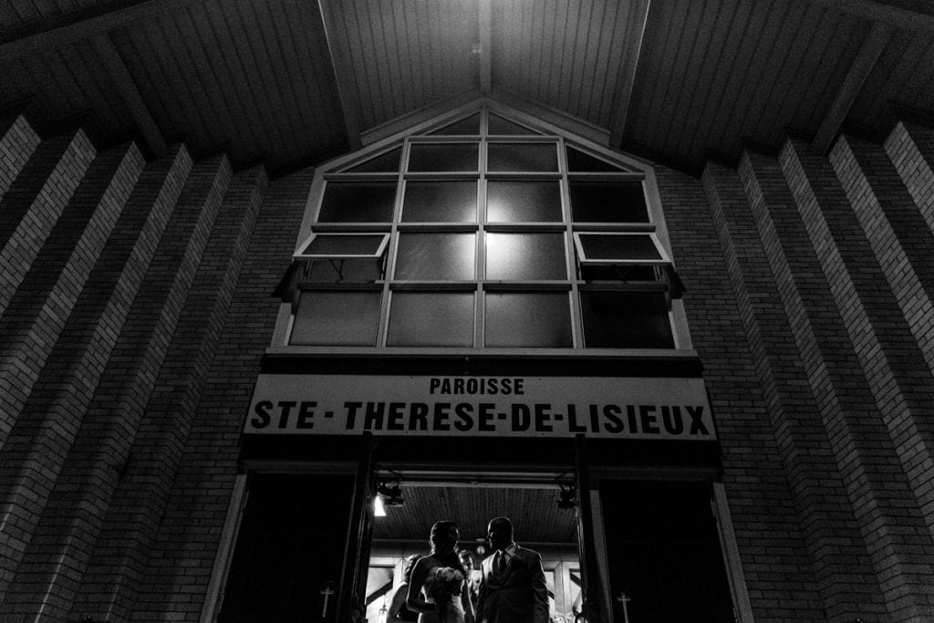 Bride and groom at church doors after their Cornwall evening wedding