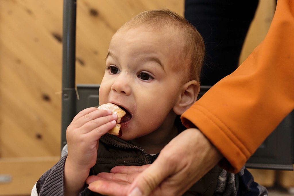 grandma catching sugar from donut