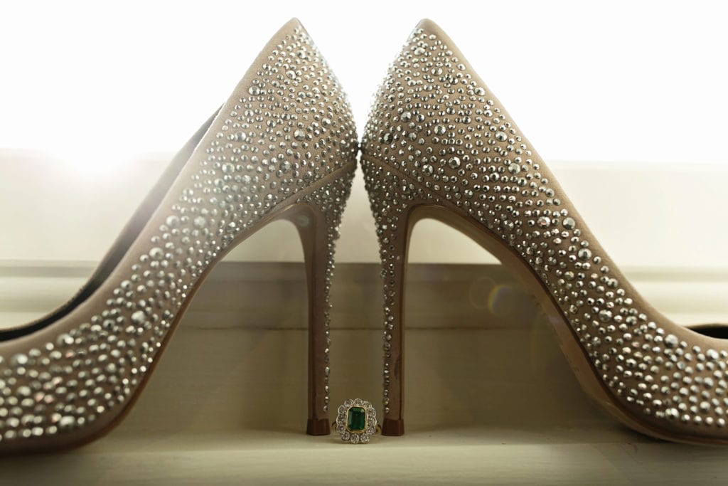 detail photo of bride's sparkly stiletto heels and borrowed emerald ring during bridal prep at Christchurch Habour Hotel & Spa