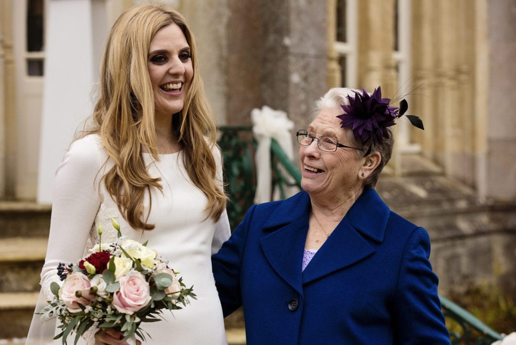 Bride with grandmother after Highcliffe Castle wedding ceremony