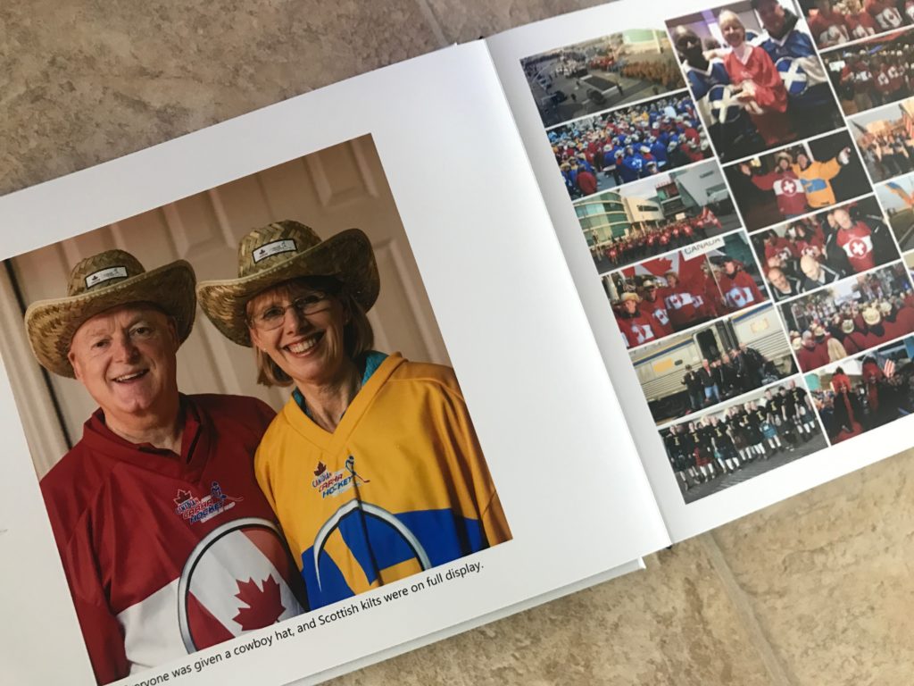 Man and woman with cowboy hats and large collage page of team members