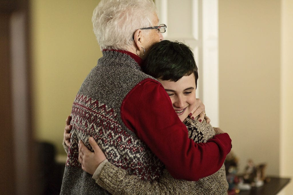 grandson hugs grandmother