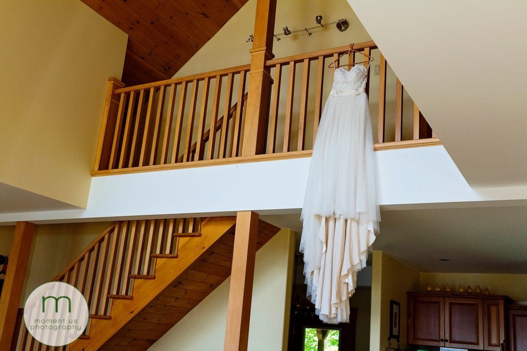 dress hangs from balcony before Calabogie wedding