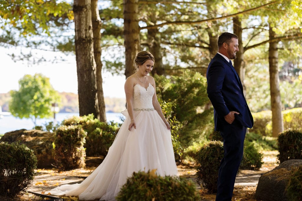 bride and groom look excited right before seeing each other for wedding first look