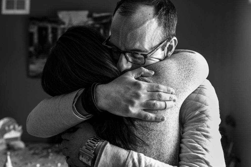 brother and sister hug tightly during Eastern Ontario family photojournalism session