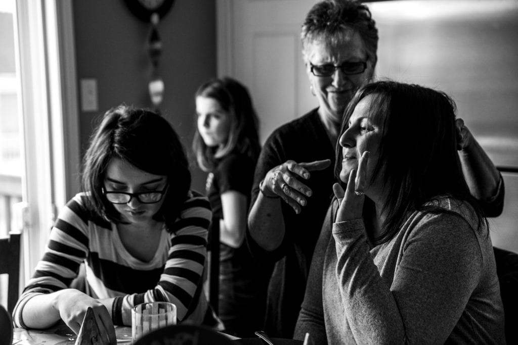 mother pretends to strangle daughter