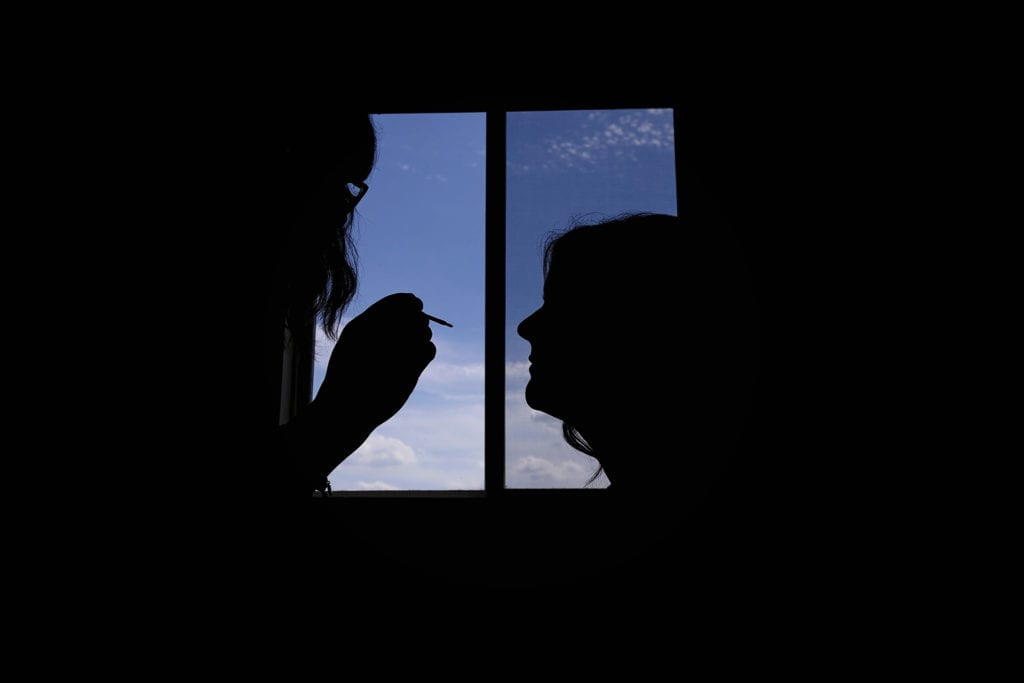 bride has makeup applied before Intimate Cornwall Backyard Wedding