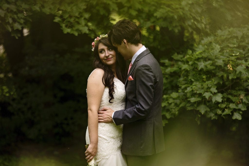 bride and groom cuddle during first look ahead of Strathmere wedding ceremony